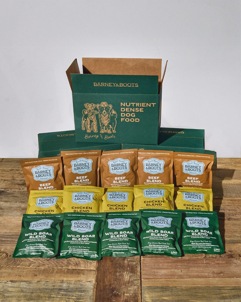 A Barney & Boots subscription box with fifteen packs of Beef, Chicken and Wild Boar
